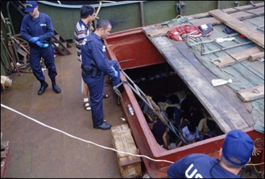 Color image of an August 1999 Coast Guard interdiction of Motor Vessel Yu Xing. The ship was interdicted north of Midway Island with 75 migrants from the People’s Republic of China. Color image of an August 1999 Coast Guard interdiction of Motor Vessel Yu Xing. The ship was interdicted north of Midway Island with 75 migrants from the People’s Republic of China.